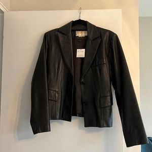 Vintage leather jacket from Brooklyn thrift store.